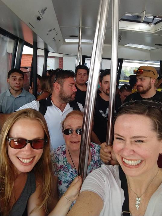 A group of people taking a selfie

Description automatically generated