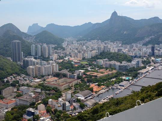 A view of a city with a mountain in the background

Description automatically generated