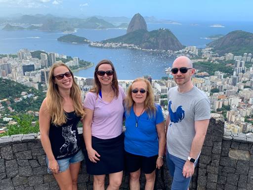 A group of people posing for the camera

Description automatically generated