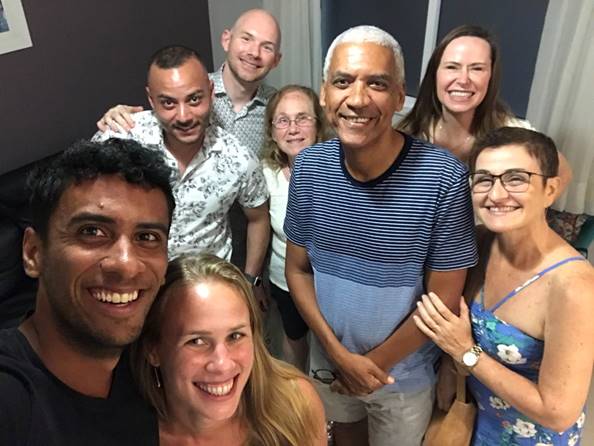 A group of people posing for the camera

Description automatically generated