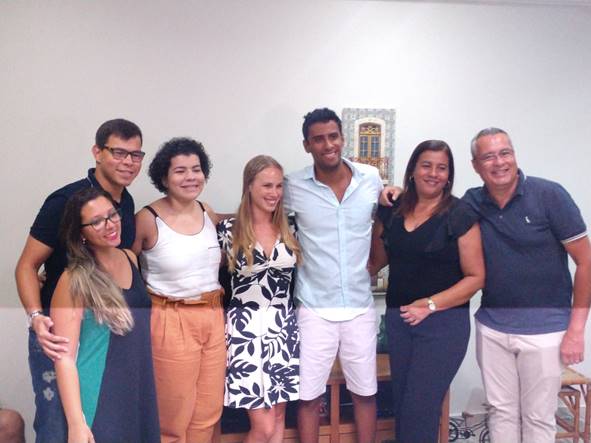 A group of people posing for the camera

Description automatically generated