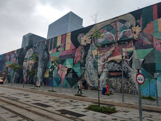 A painting on the side of a building

Description automatically generated